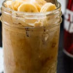 Peanut butter overnight oats in a mason jar with a spoon sticking out