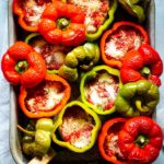 Keto sausage stuffed peppers in a baking dish