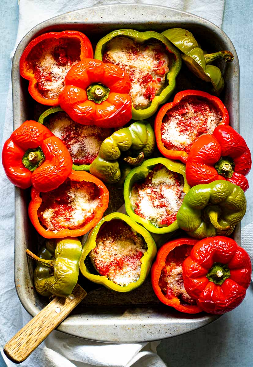 Baked keto stuffed peppers arranged in a baking pan