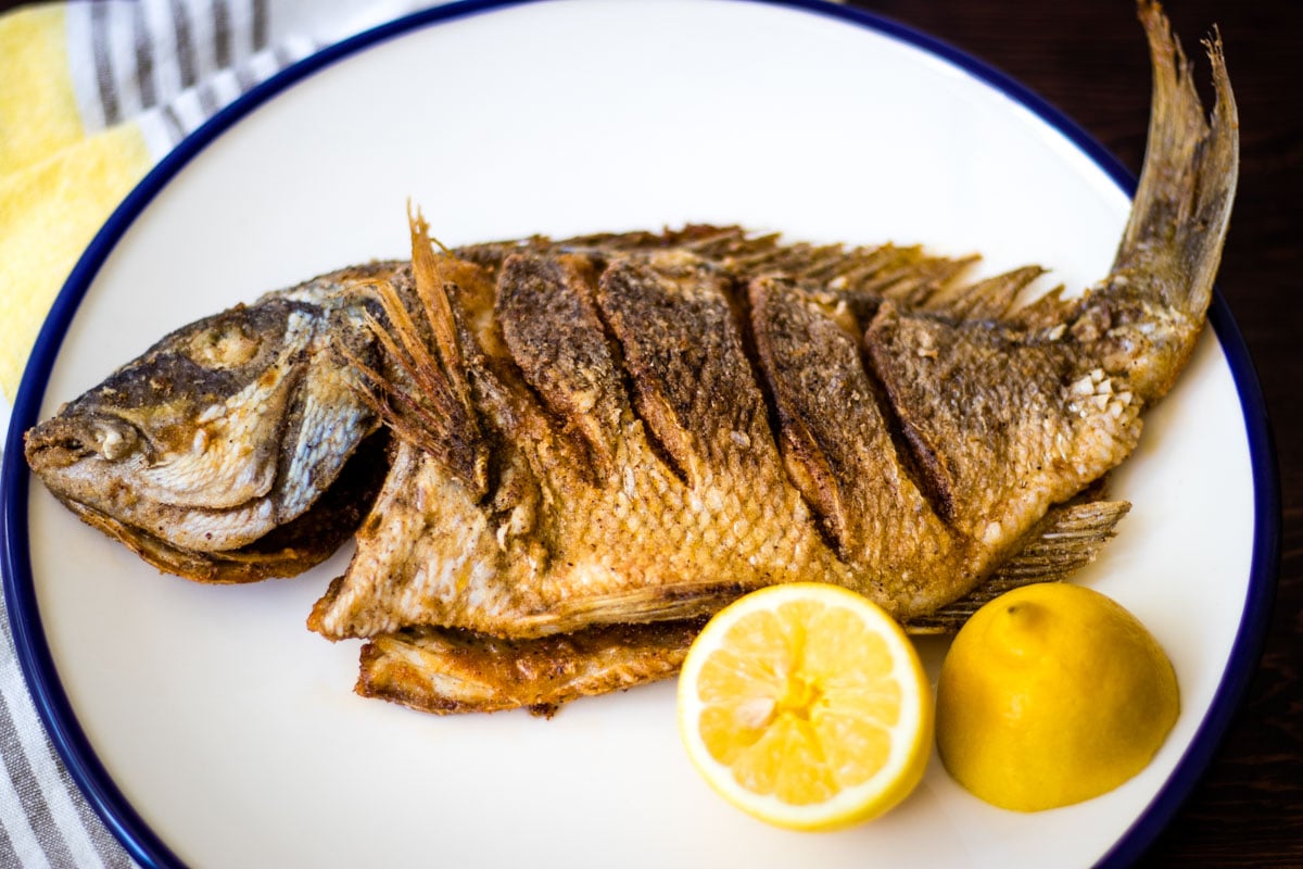 Pan-fried whole fish is one of the best ways to prepare freshly caught fish and it is easier than you think. This tasty fried fish is crisp and golden outside and hot and juicy inside.