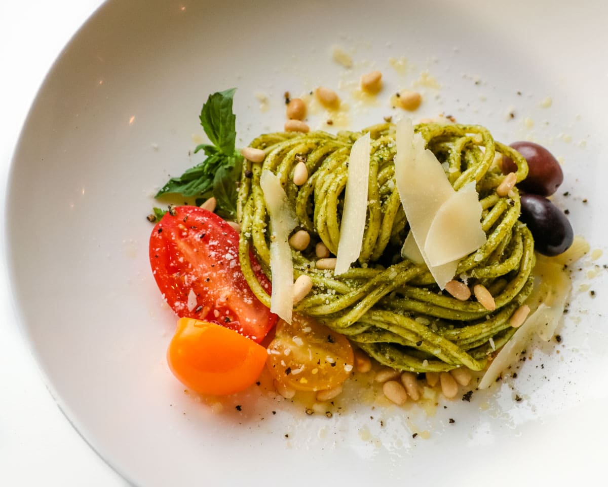 Fresh pesto is wonderful tossed with hot pasta. Top with freshly cracked black pepper, shaved Parmigiano-Reggiano cheese and toasted pine nuts, and you'll have a protein-packed vegetarian-friendly meal in minutes.