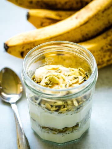 Yogurt parfait with banana and salted pumpkin seeds