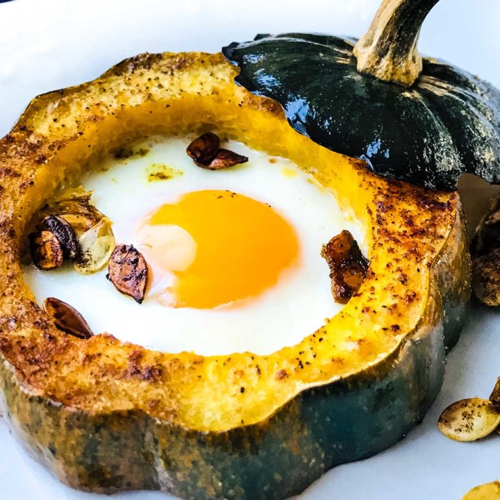 Baked acorn squash eggs in a hole • We Count Carbs