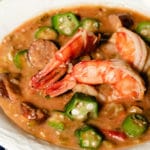 Okra is simmered in a thick gravy with shrimp, chicken, and Andouille sausage until the flavors deepen into a rich, velvety gumbo.