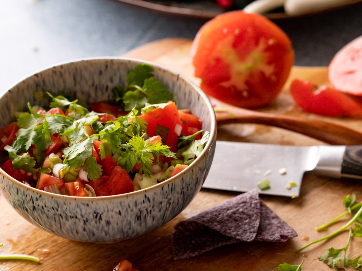 This homemade salsa recipe is made with chunks of fresh juicy tomatoes, spicy jalapeños and scallions. Simply seasoned with vinegar and sea salt. This easy, tasty salsa is great as a dip or to add flavor to your favorite dishes.