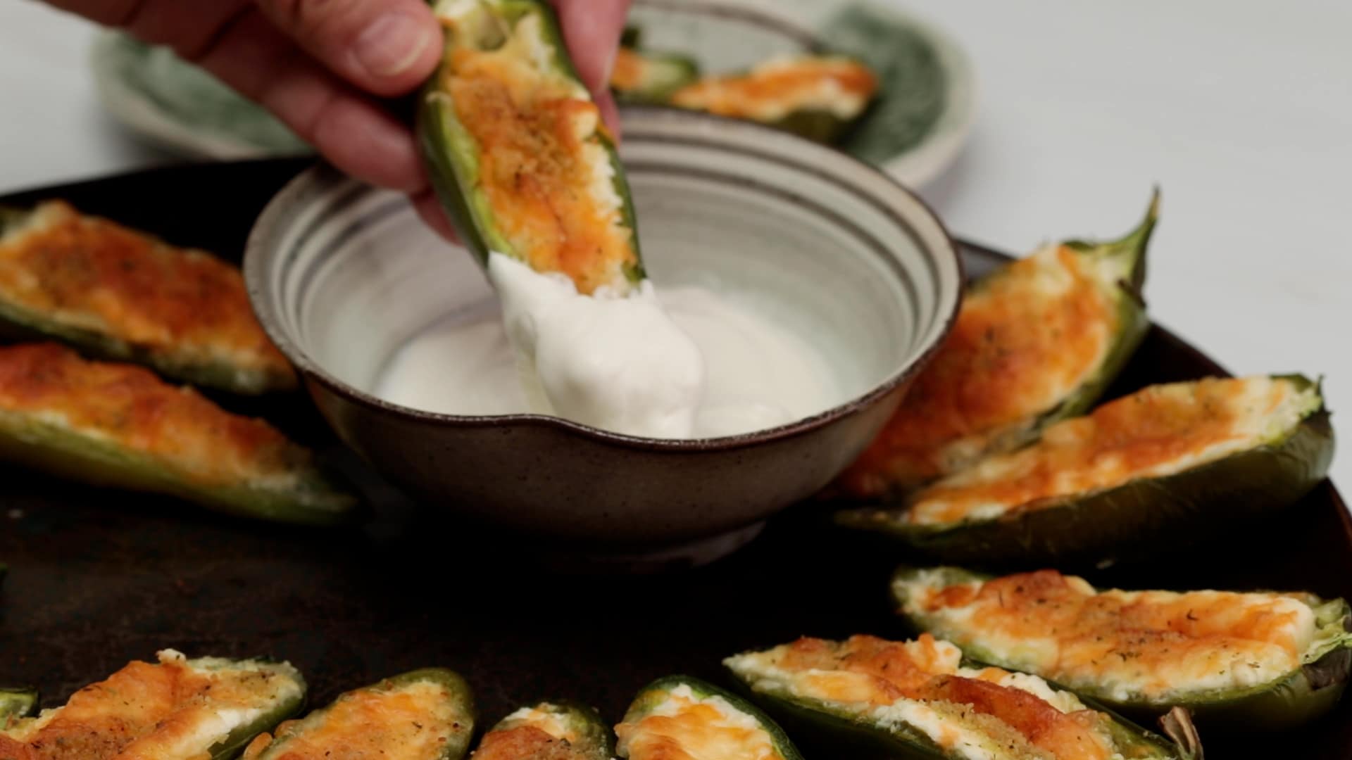 Spicy, cheesy jalapeño poppers are great dipped in cooling sour cream!