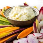 Toum Lebanese Garlic Sauce served as a dip in a bowl with fresh raw vegetables