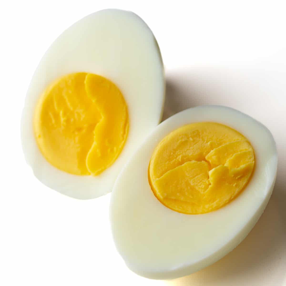 two halves of a hard boiled egg showing yolks