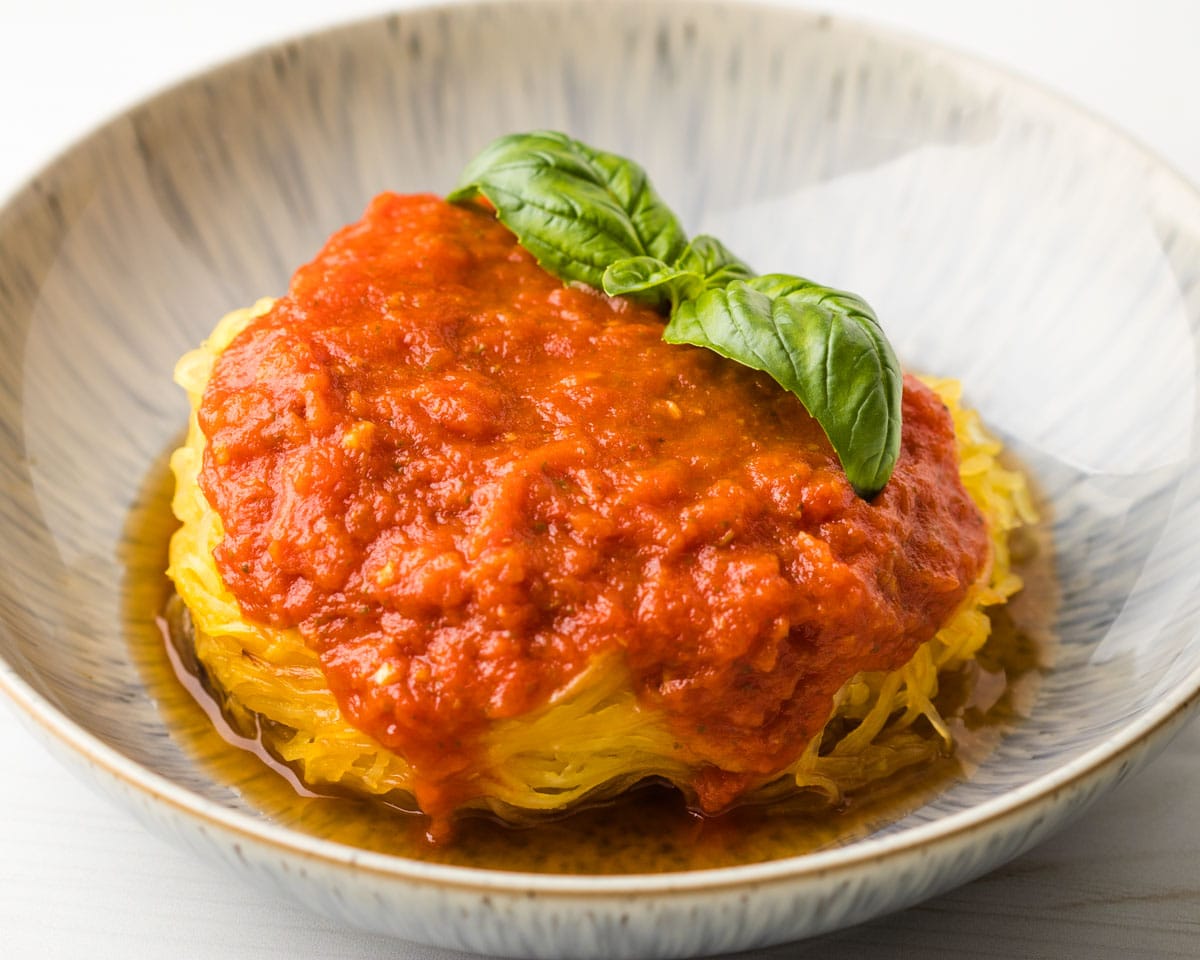 air fryer spaghetti squash noodles plated with pasta sauce