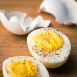 Perfectly smooth, easy to peel, steamed hard boiled eggs sliced in half with salt and pepper