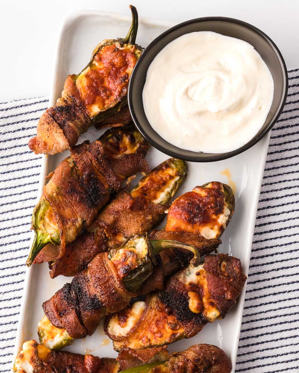 Air fryer bacon jalapeño poppers are great dipped in sour cream