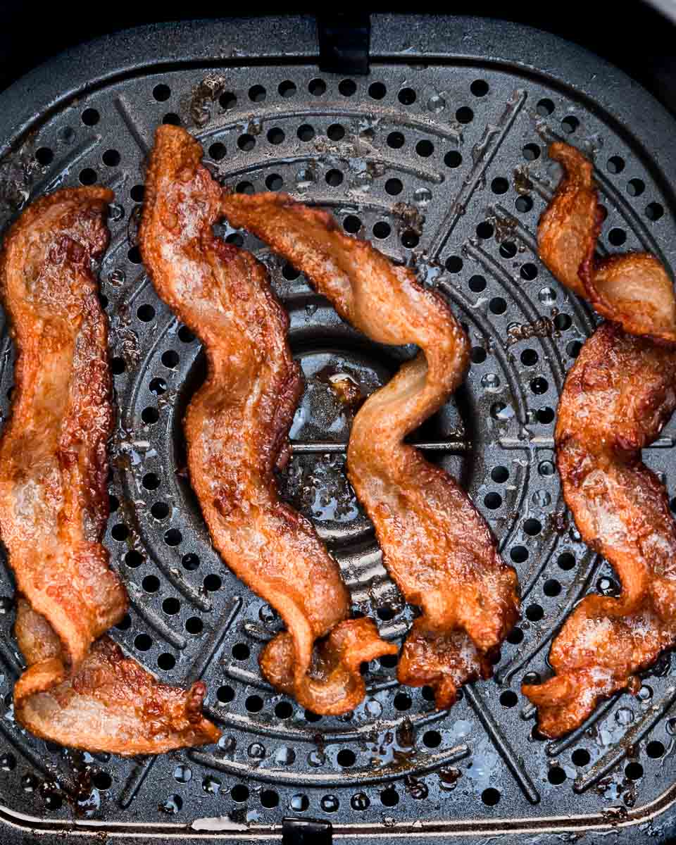 Air fryer bacon cooked perfectly crispy in air fryer basket