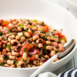 Black-eyed pea salad served in a bowl with a spoon