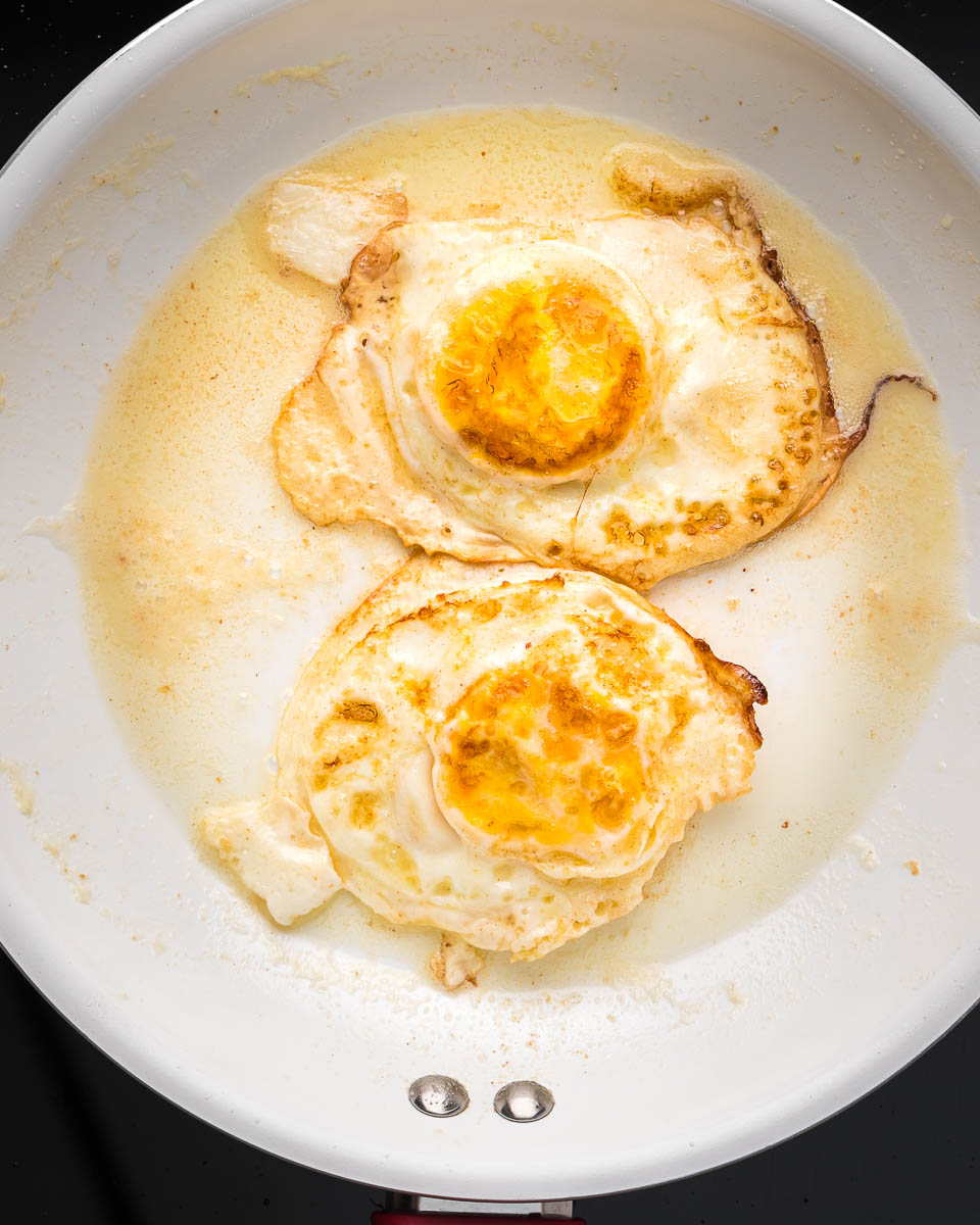 Eggs over hard flipped in pan