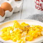 air fryer scrambled eggs on a plate portrait