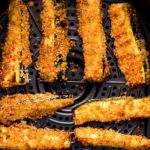Air fryer zucchini fries cooked in basket