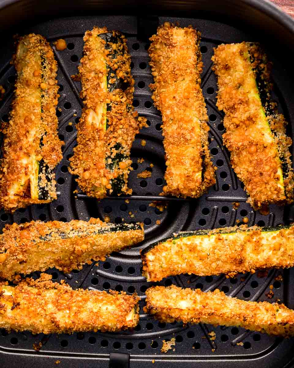 Air fryer zucchini fries cooked in basket