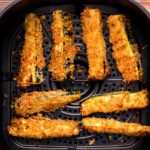 Air fryer zucchini fries in air fryer basket featured image
