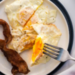 Eggs over medium egg on fork