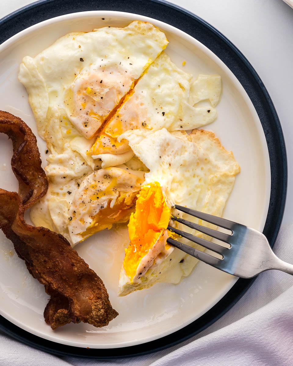 https://wecountcarbs.com/wp-content/uploads/2022/08/Eggs-over-medium-egg-on-fork.jpg