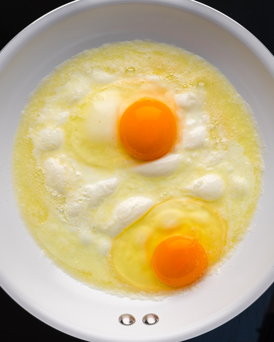 Eggs over medium step 3 crack eggs into pan