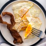 Over medium eggs on fork featured image