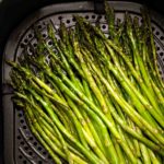 Air fryer asparagus in fryer basket featured image