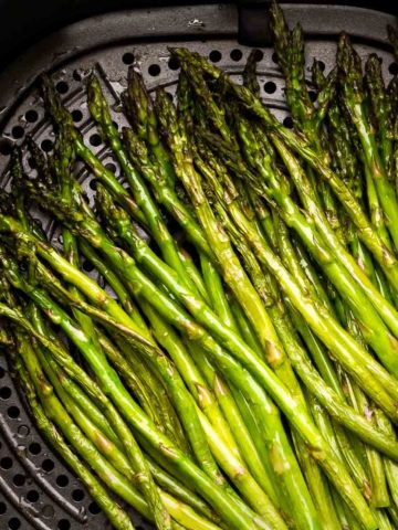 Air fryer asparagus in fryer basket featured image