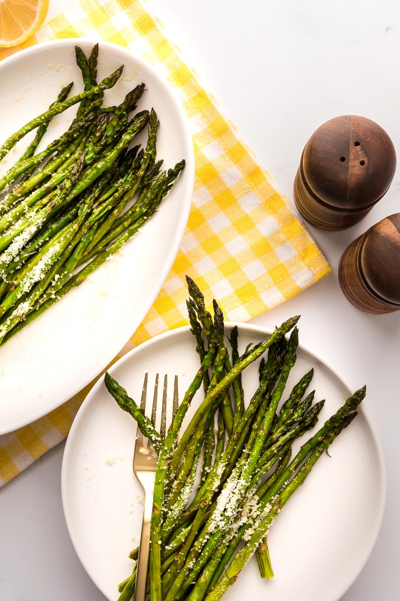 Air fryer asparagus plated with Parmesan cheese
