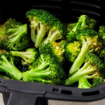 Air fryer broccoli in air fryer basket featured image