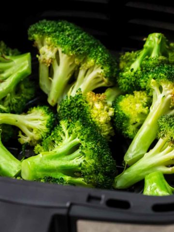 Air fryer broccoli in air fryer basket featured image