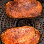 Air fryer pork chops cooked in air fryer basket extra closeup