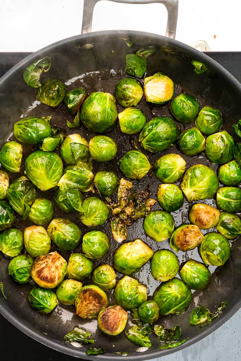 Balsamic glazed Brussels sprouts step 6 deglaze pan with balsamic vinegar and season